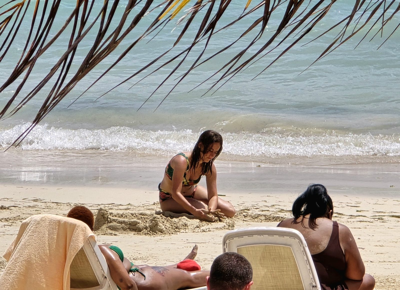 Building a sandcastle on the beach at our resort