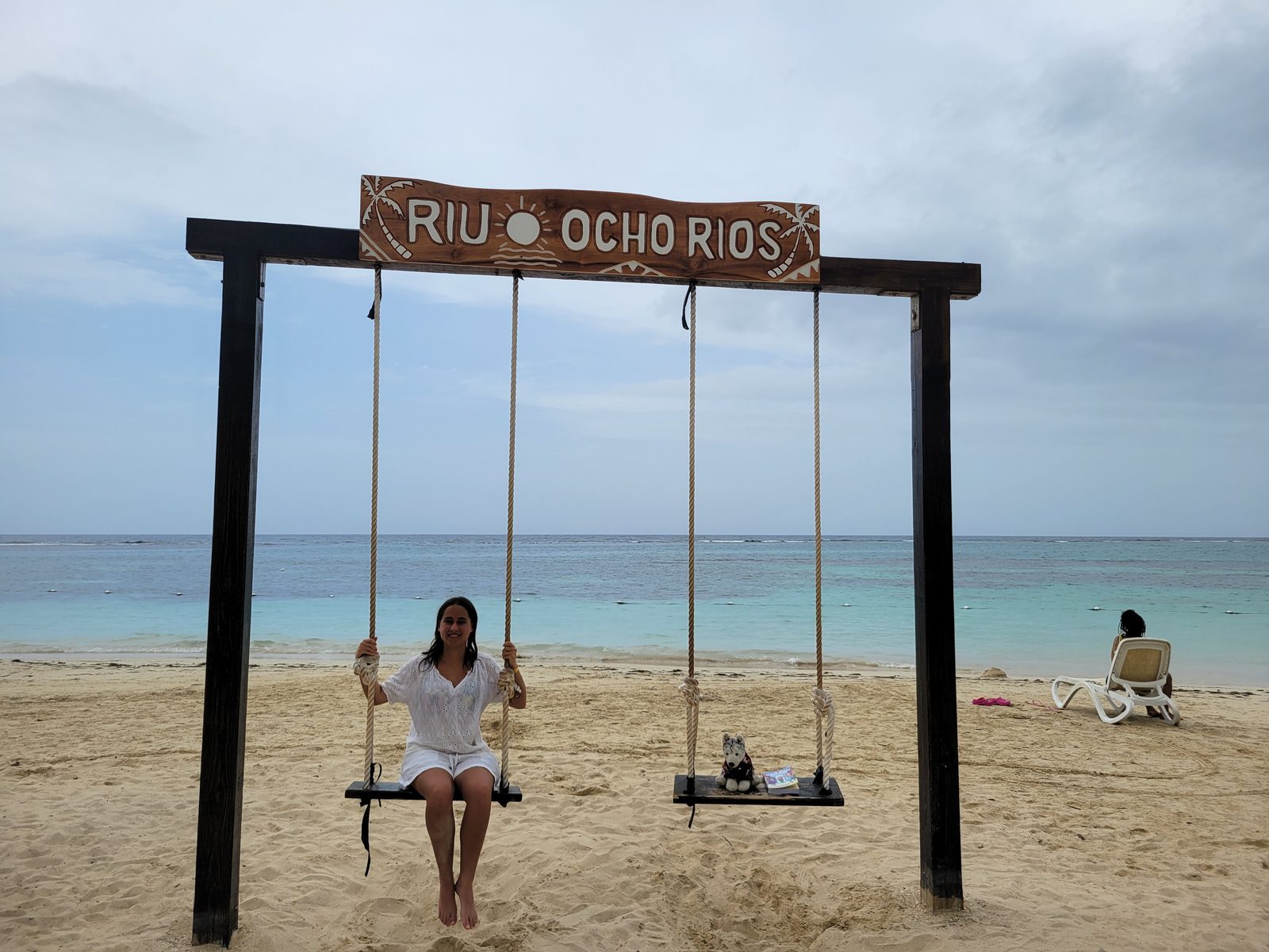 Lisa on the swing under the Riu Ocho Rios sign