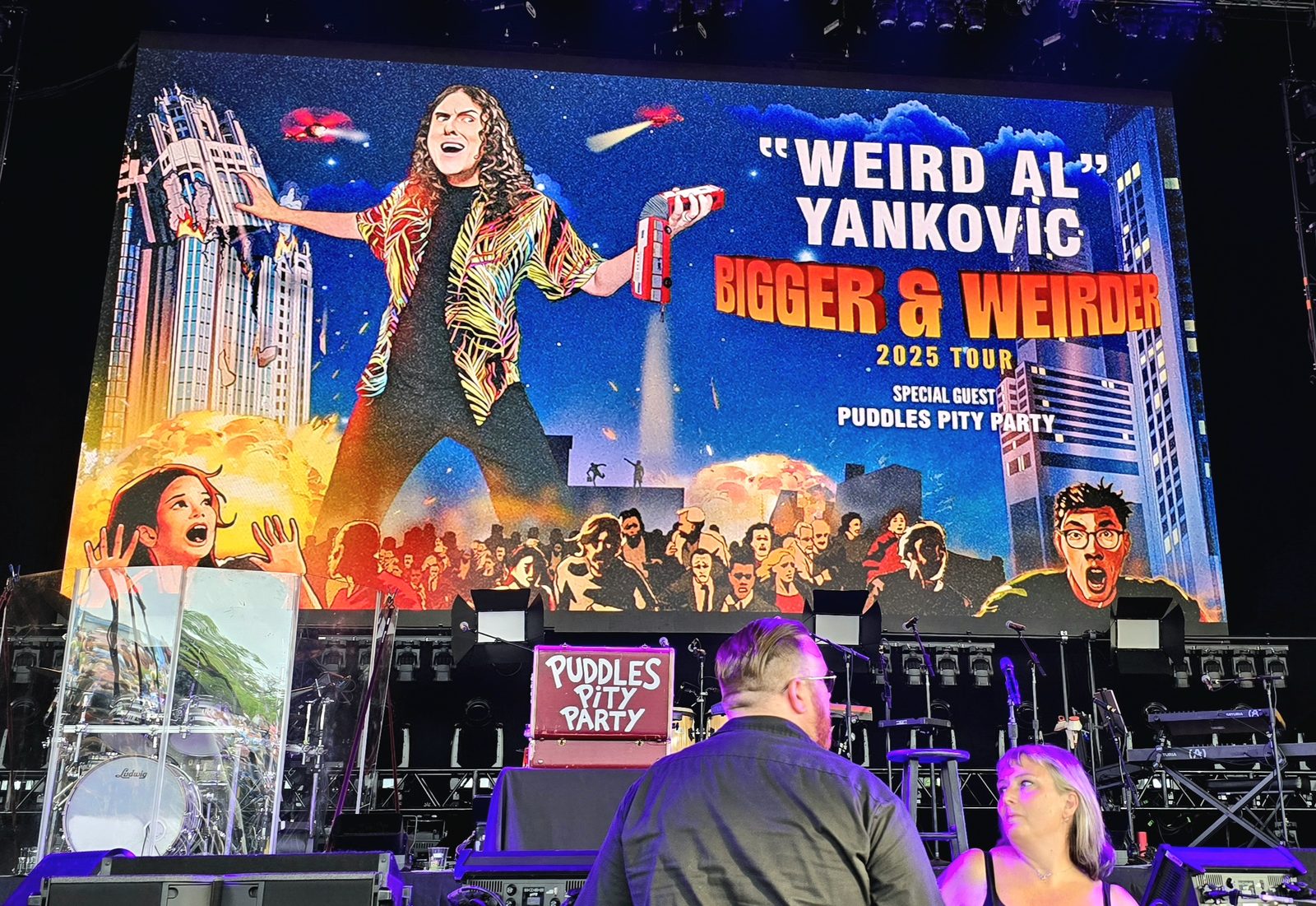 The Bigger and Weirder Tour screen before the show