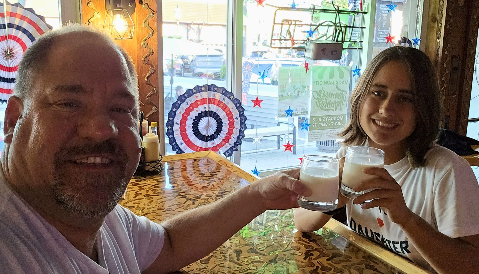 Michael and Lisa toast at dinner