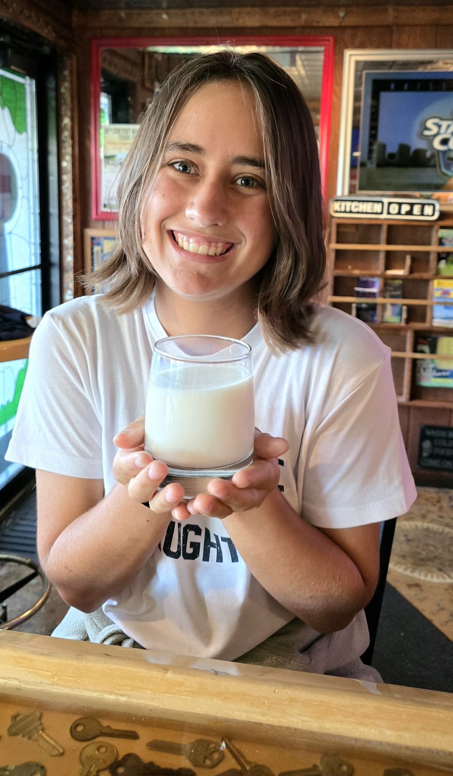 Lisa with a glass of milk in Mackinaw City