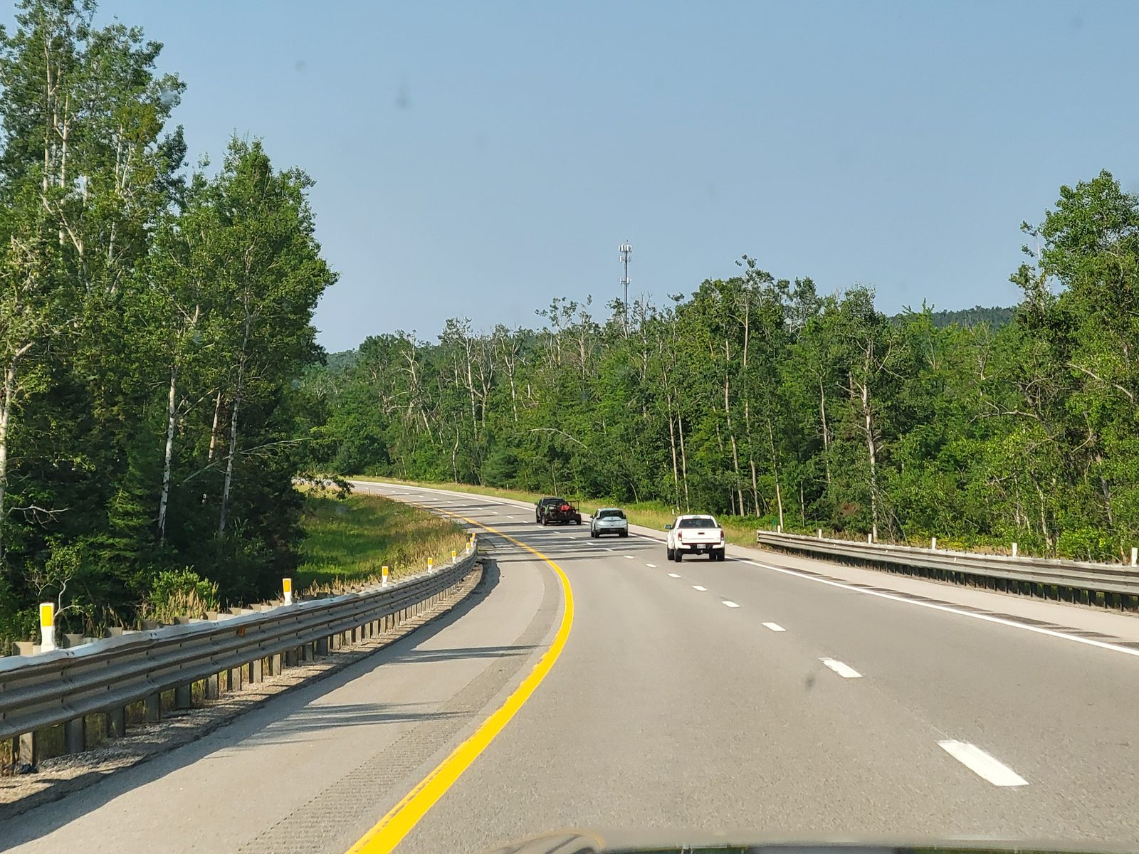 The highway curving through the north woods