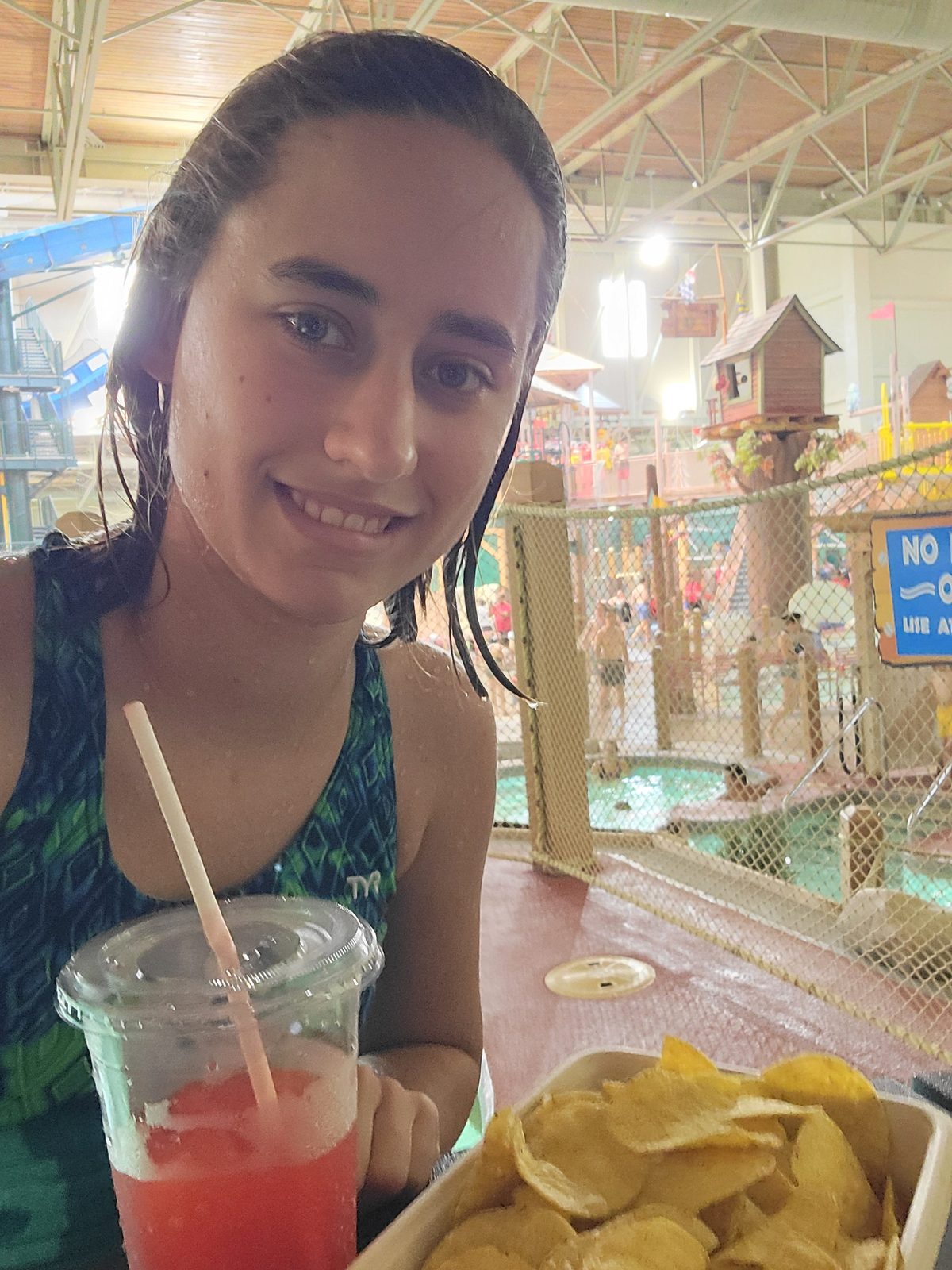 Lisa with her drink and chips