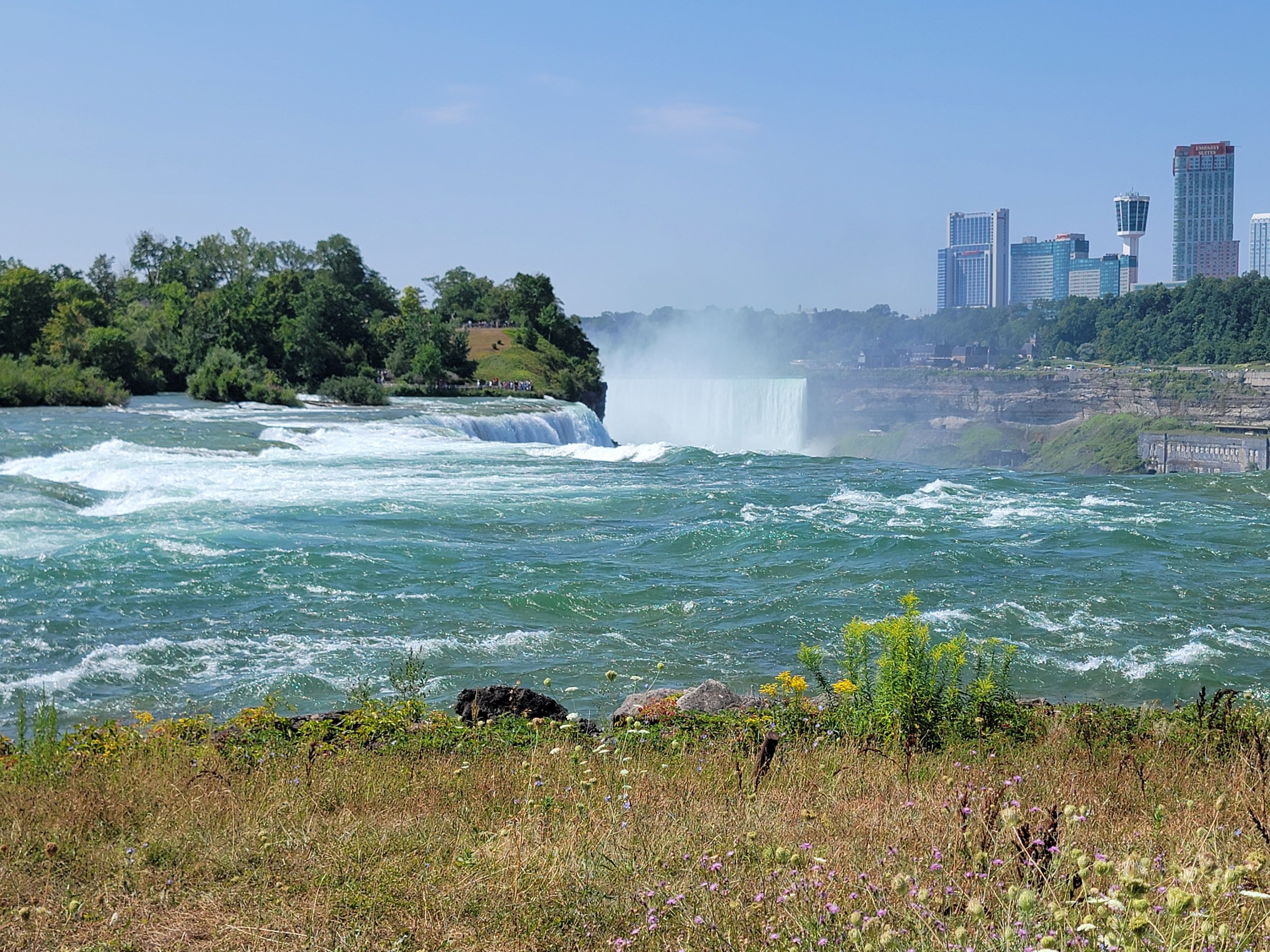 The rapids above the falls, with the Canadian skyline behind