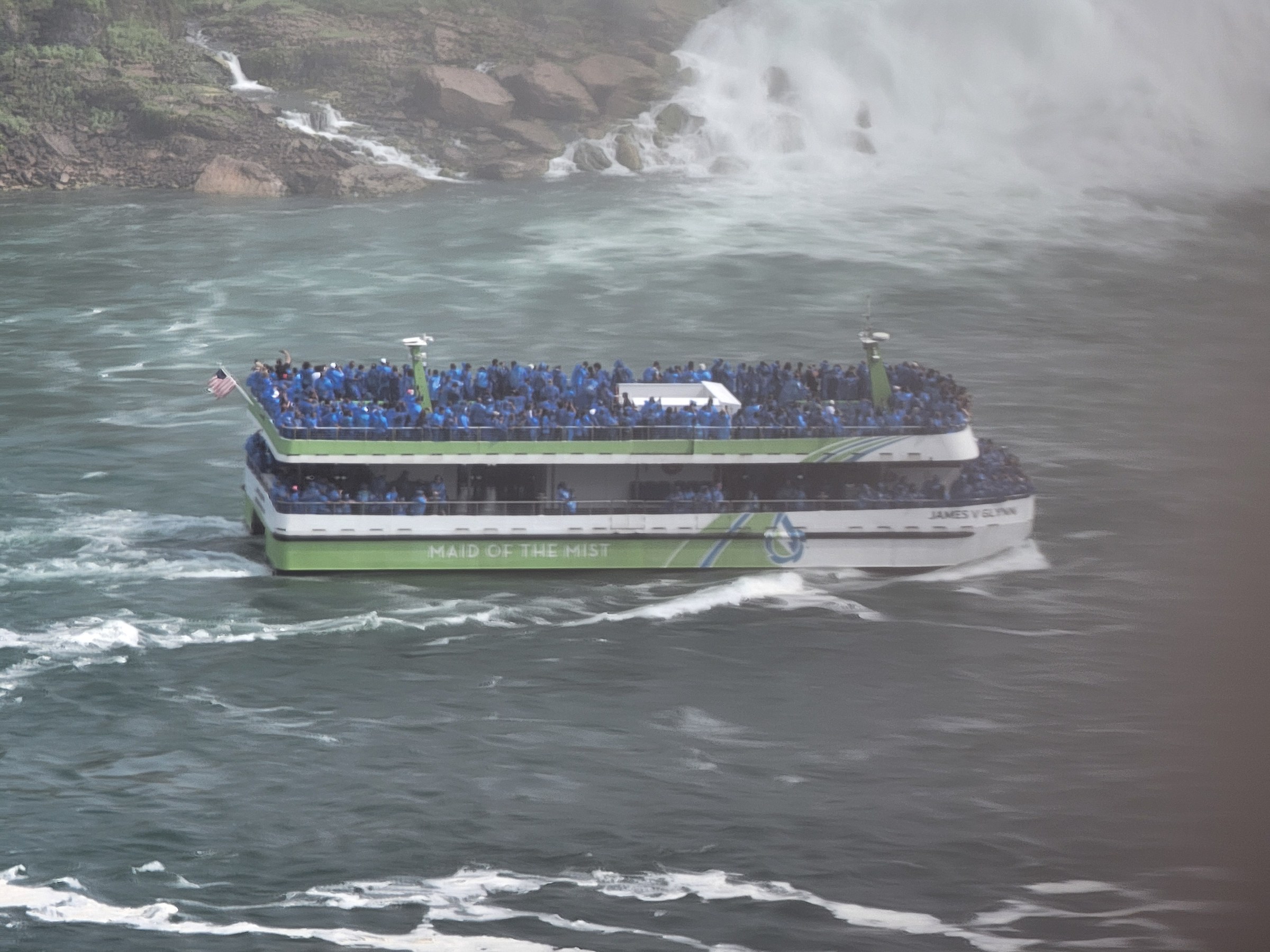A boat full of ponchos heading into the mist