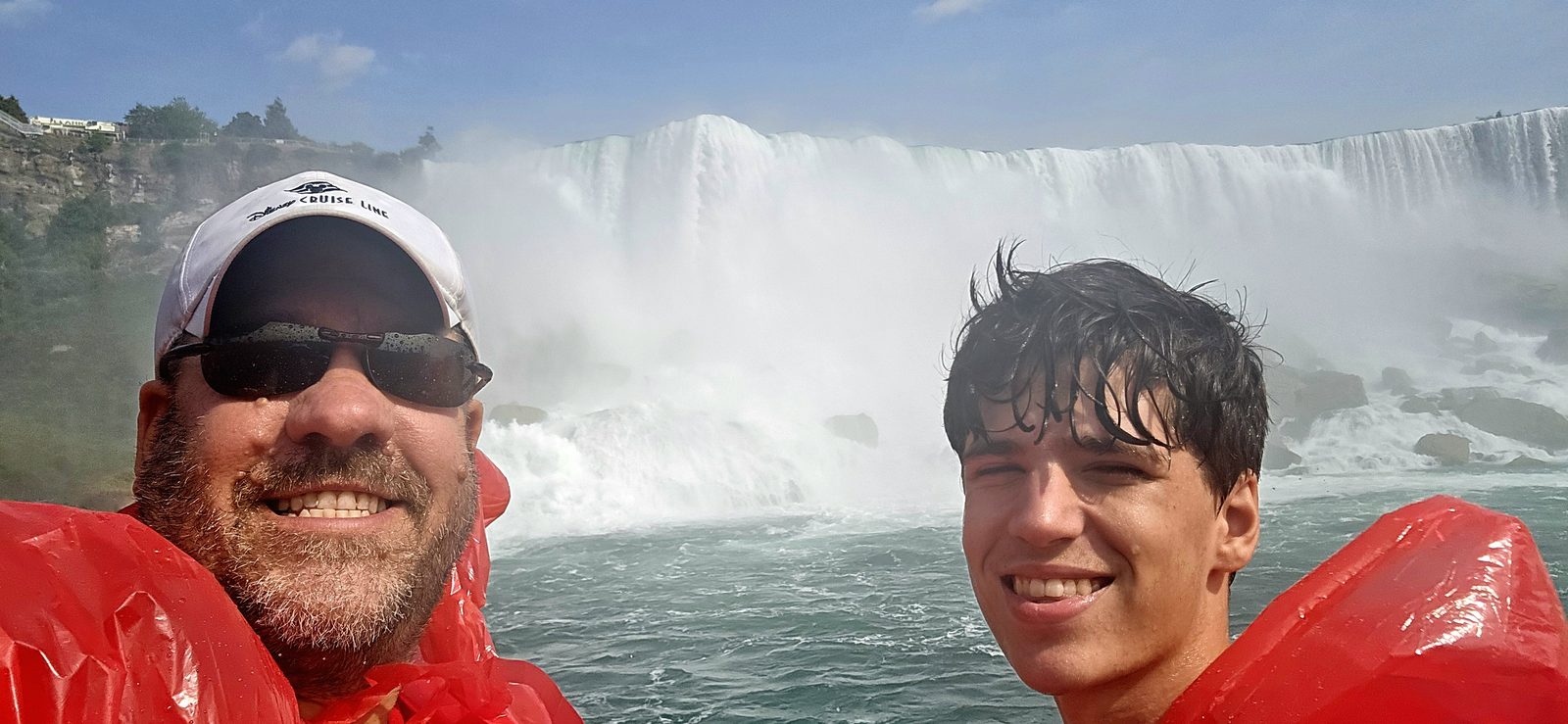 Thomas and me in the mist below the falls