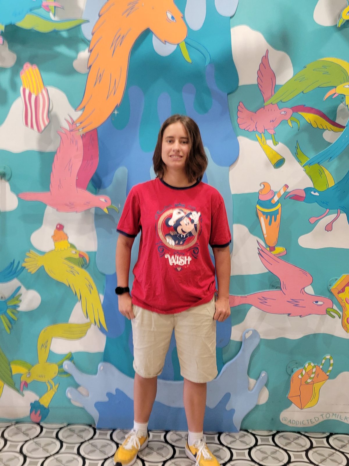 Lisa in front of the colorful mural