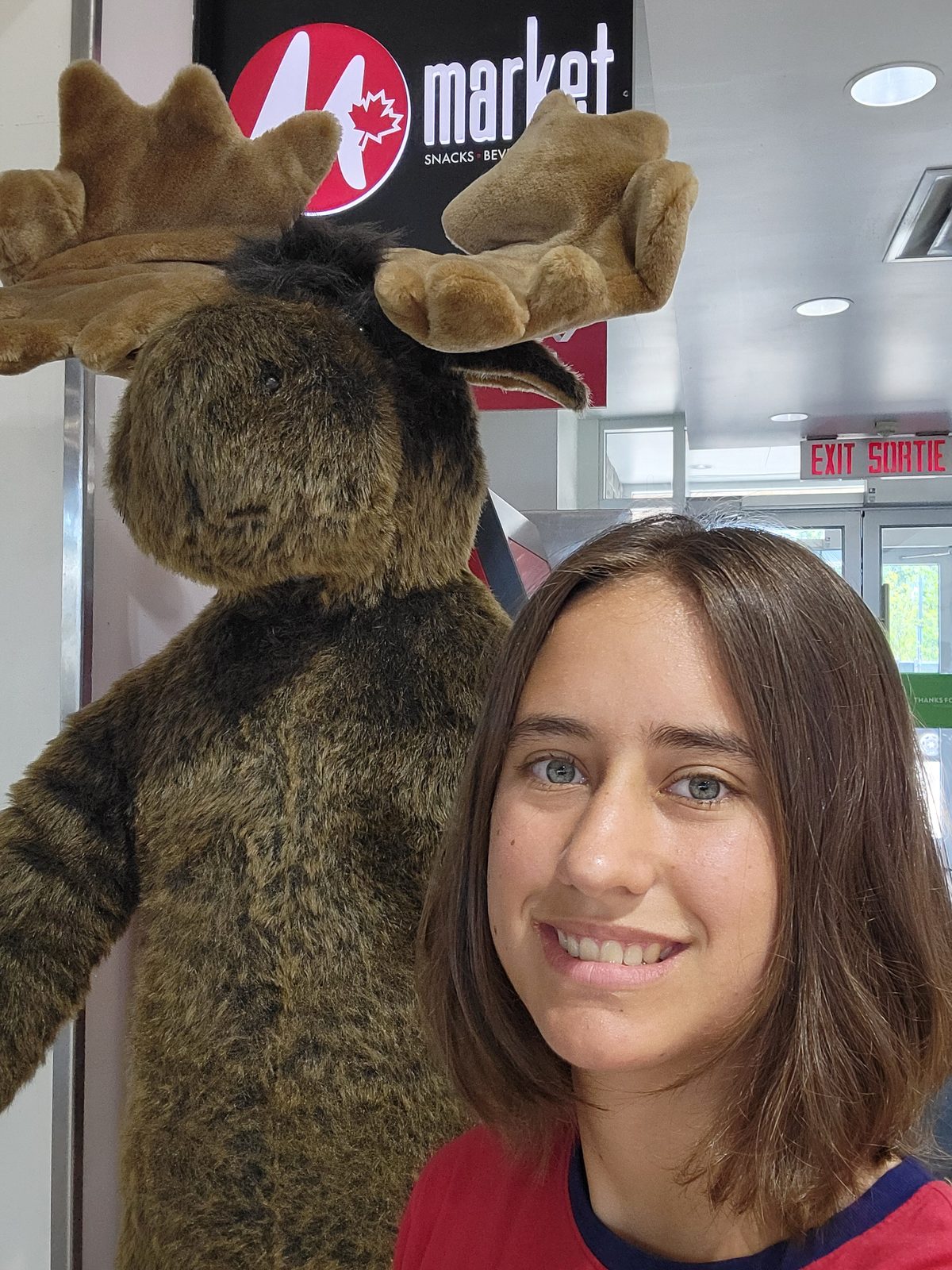 Lisa poses with a stuffed moose