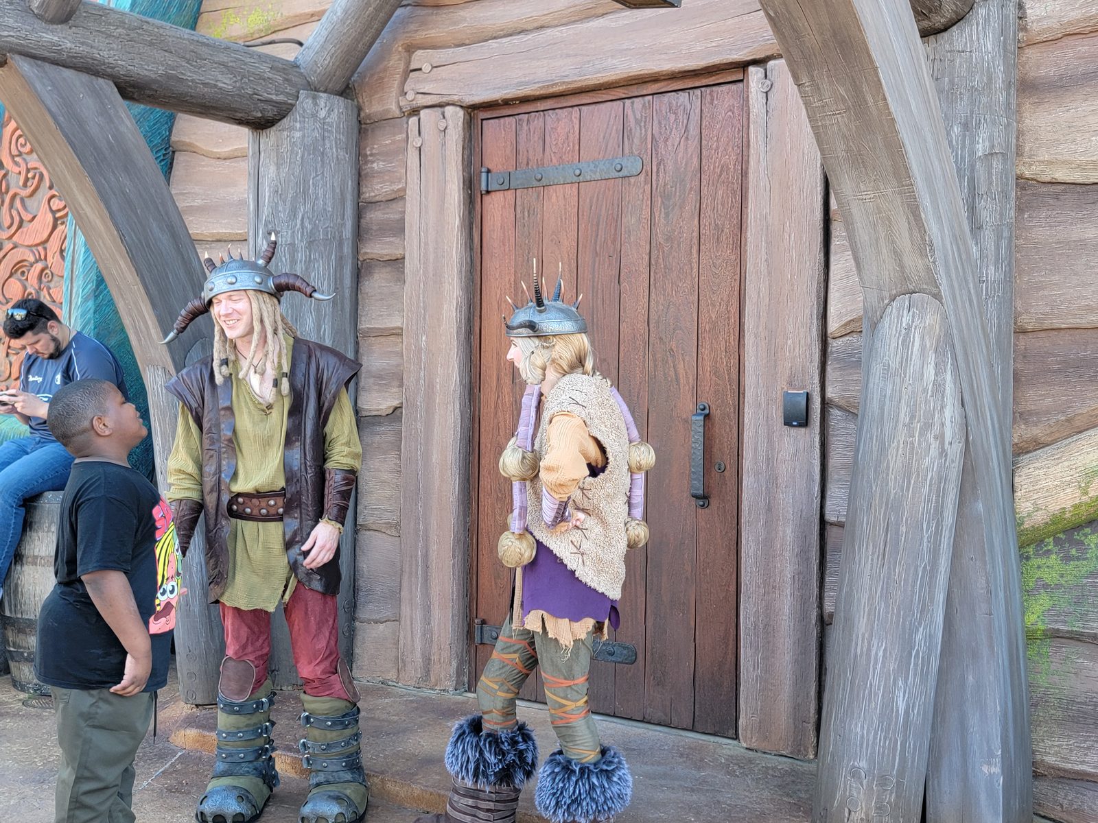 Two Vikings by a wooden door on Isle of Berk