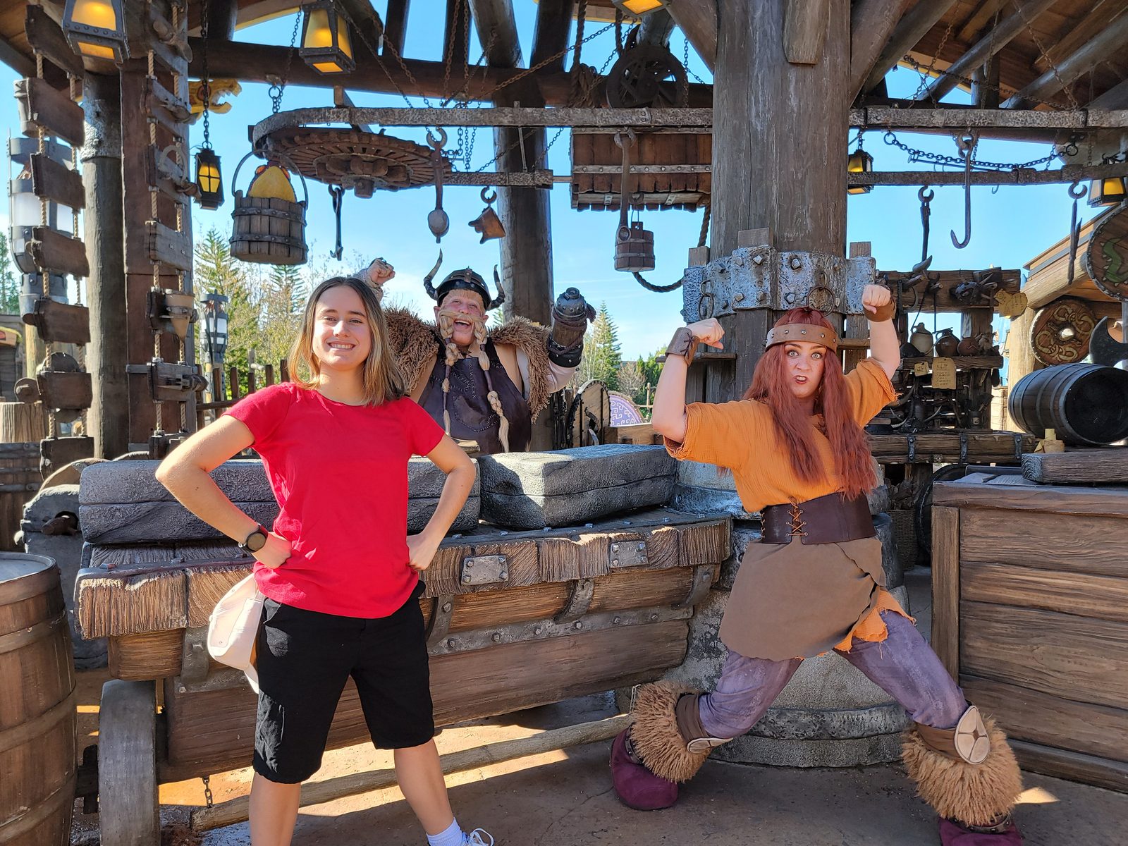 Lisa with the blacksmiths at Epic Universe