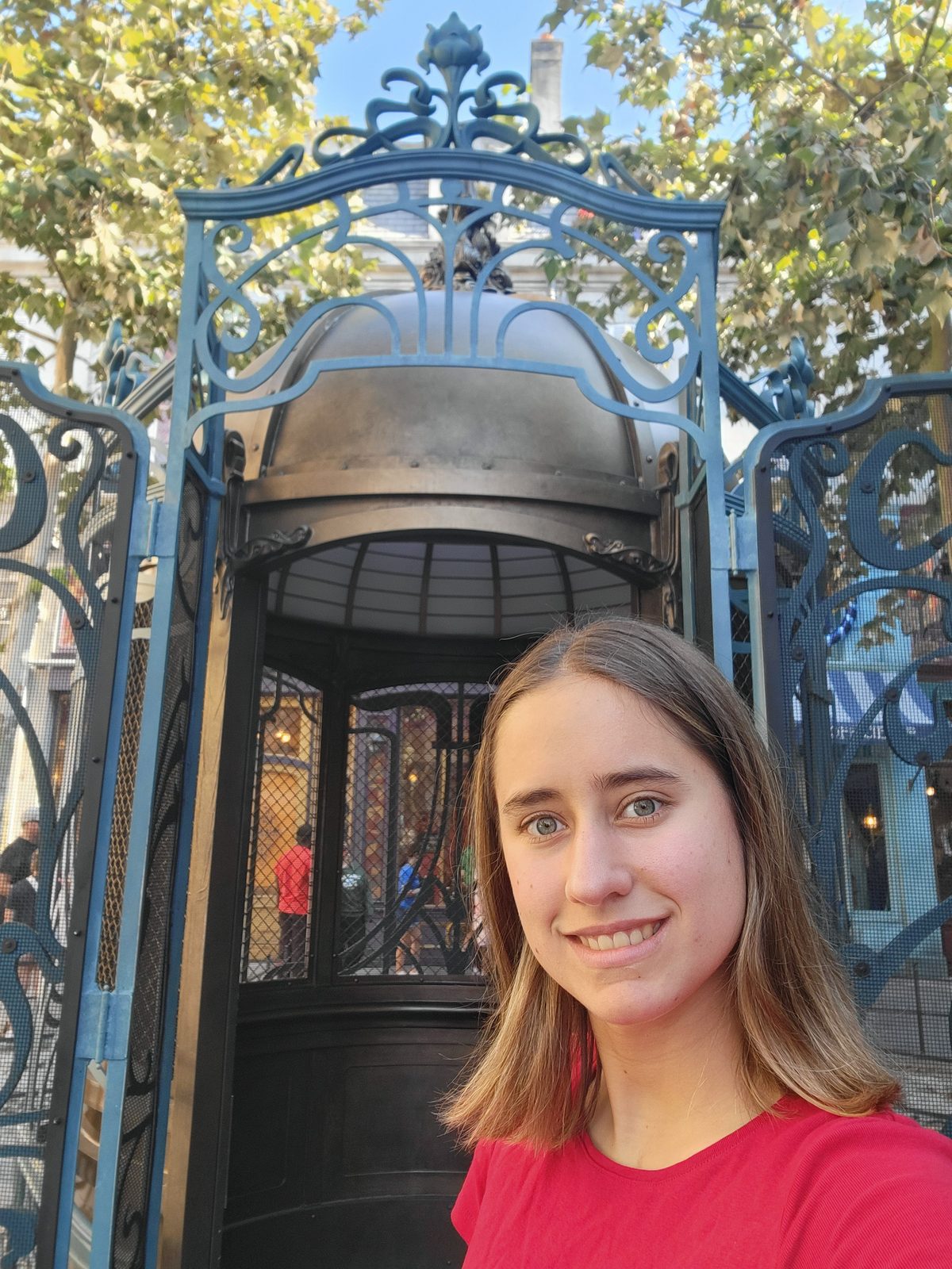 Lisa at an ornate iron gate