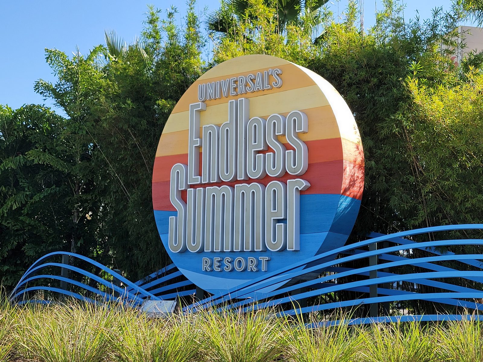 The Endless Summer Resort sign by the pool