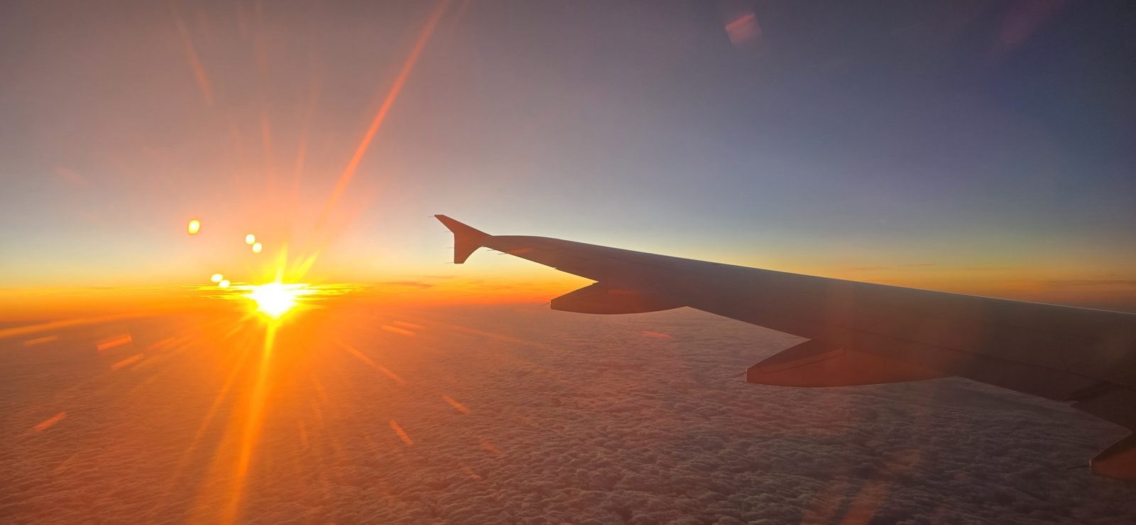 Sunset over the wing on our flight home