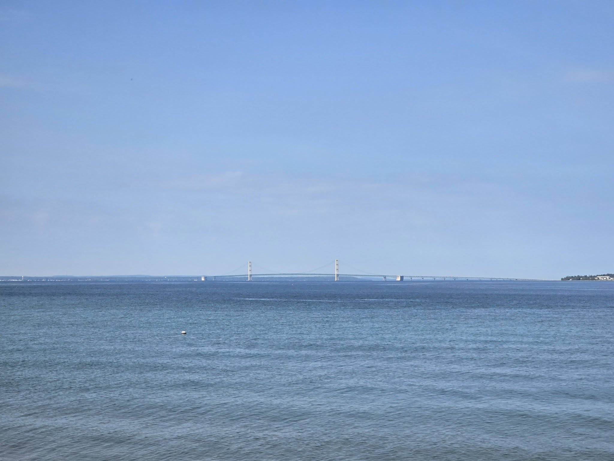 The Mackinac Bridge on the horizon from the shore road