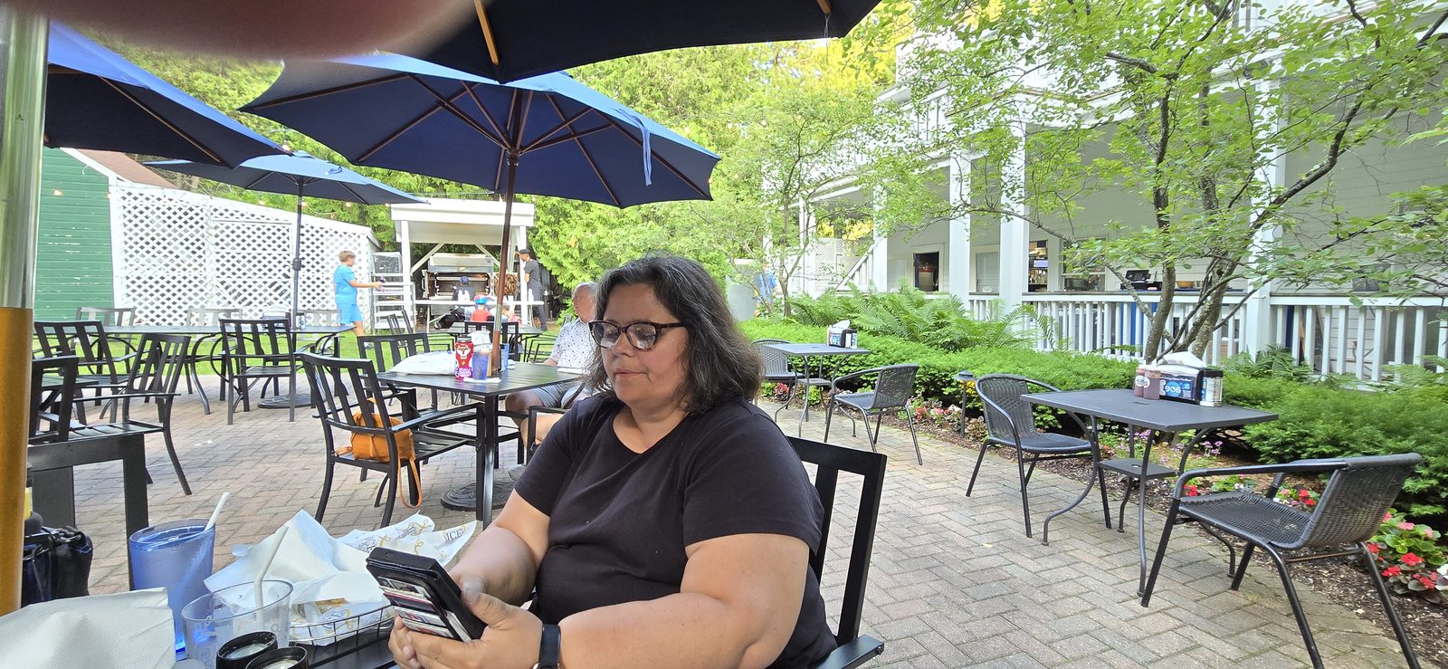 Kathy having coffee at our outdoor table