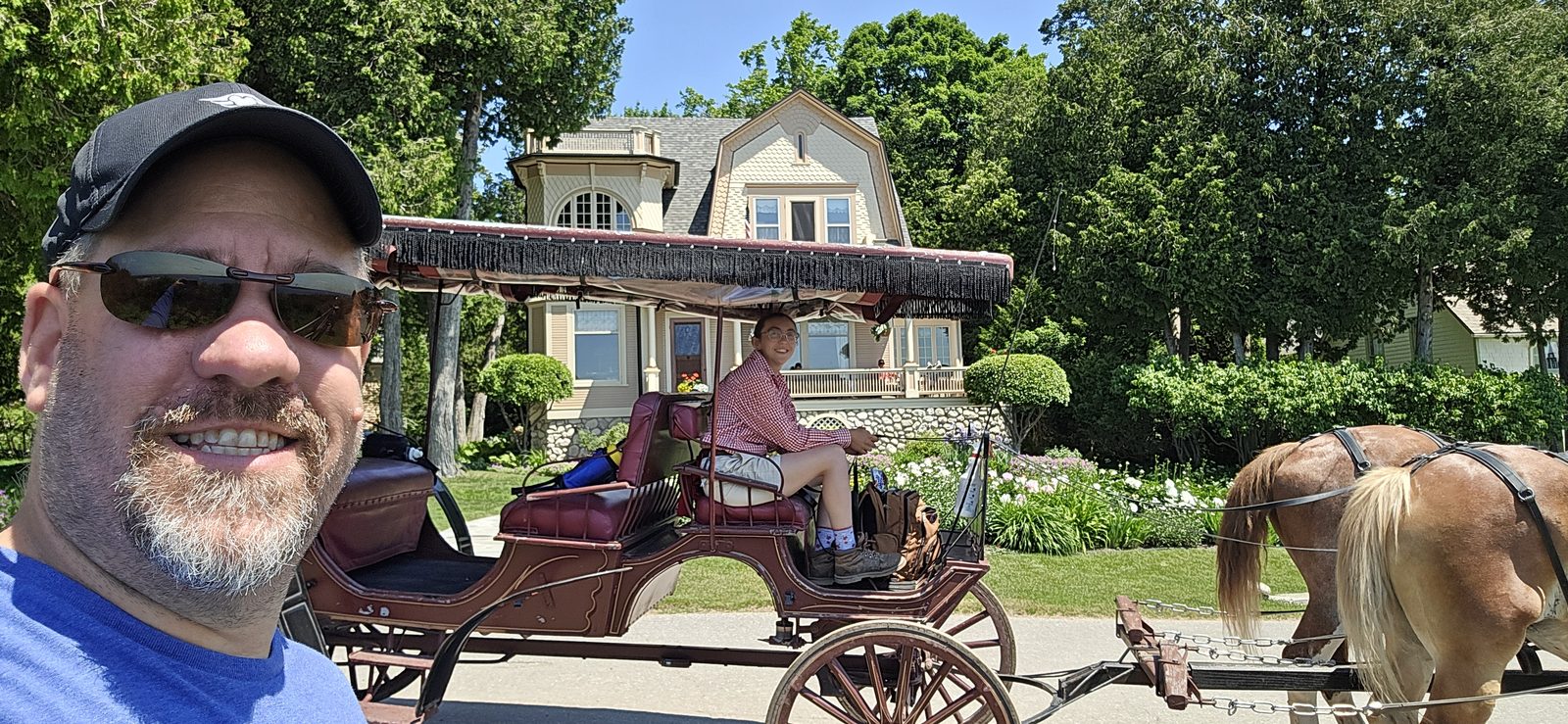Me beside a carriage on Mackinac Island