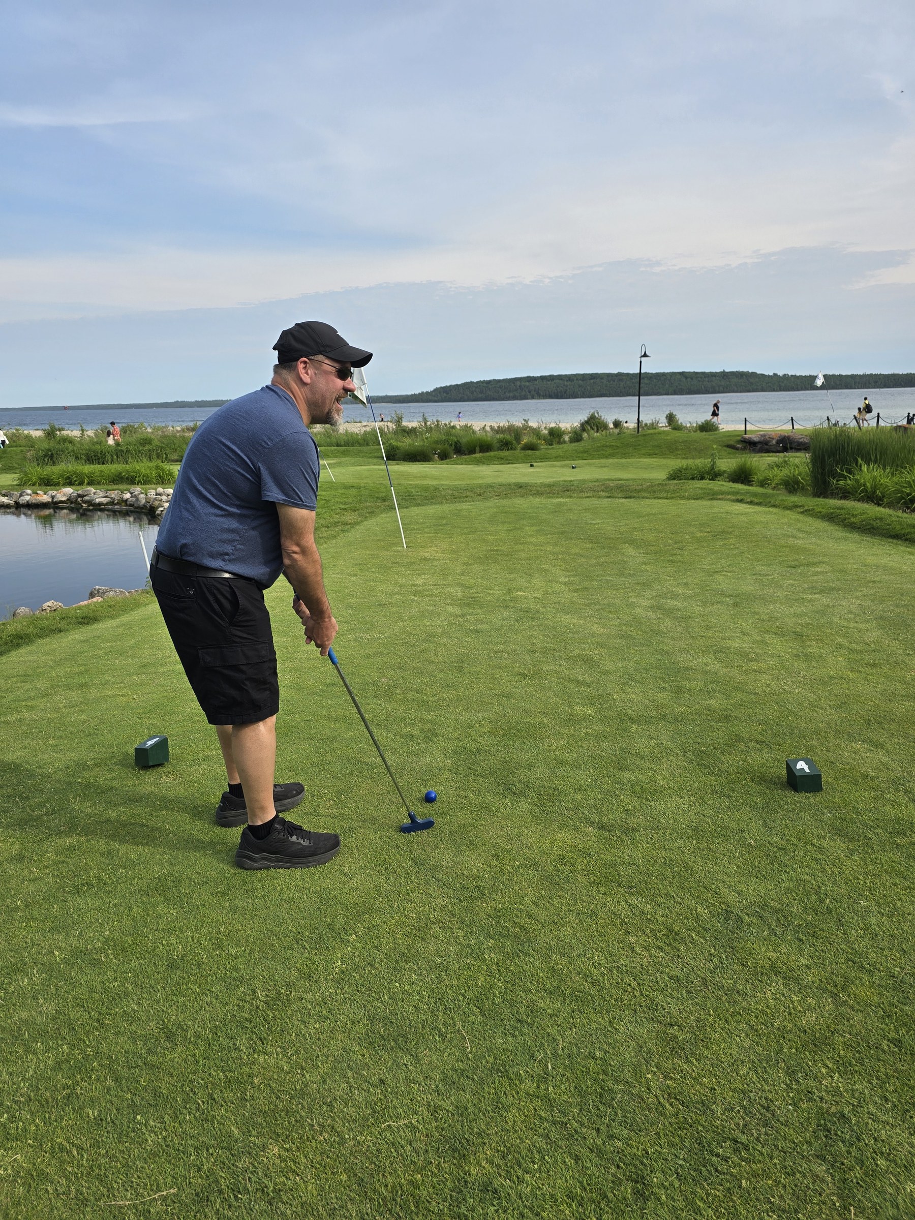 Michael, teeing off above the lake