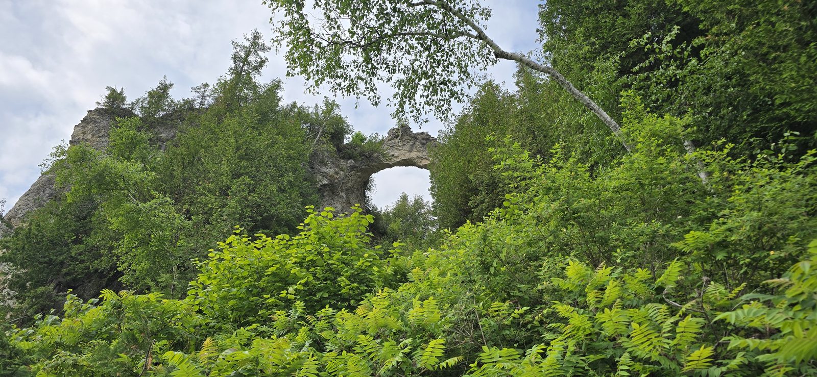 Arch Rock framing the sky over the bluff