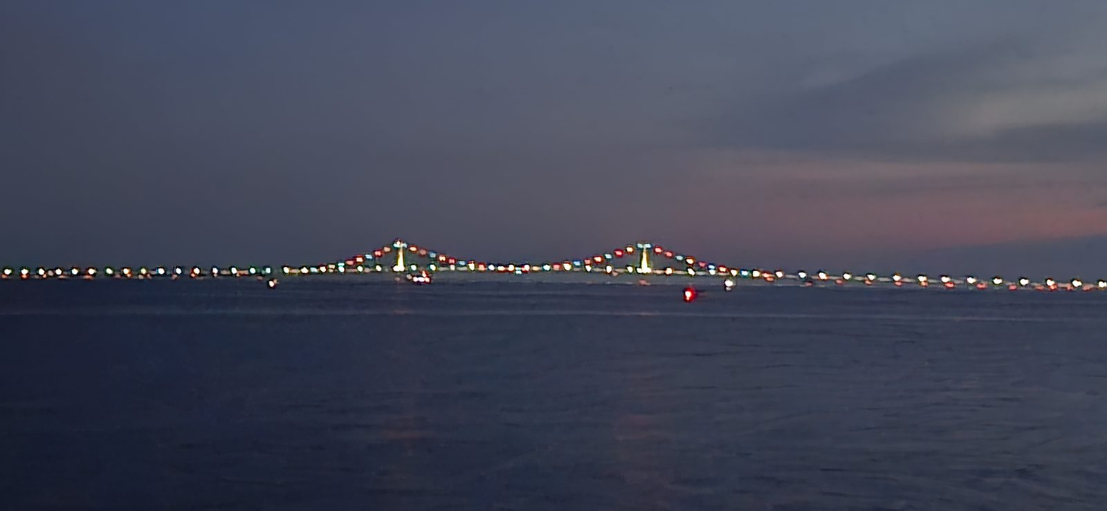 The Mackinac Bridge glowing at night