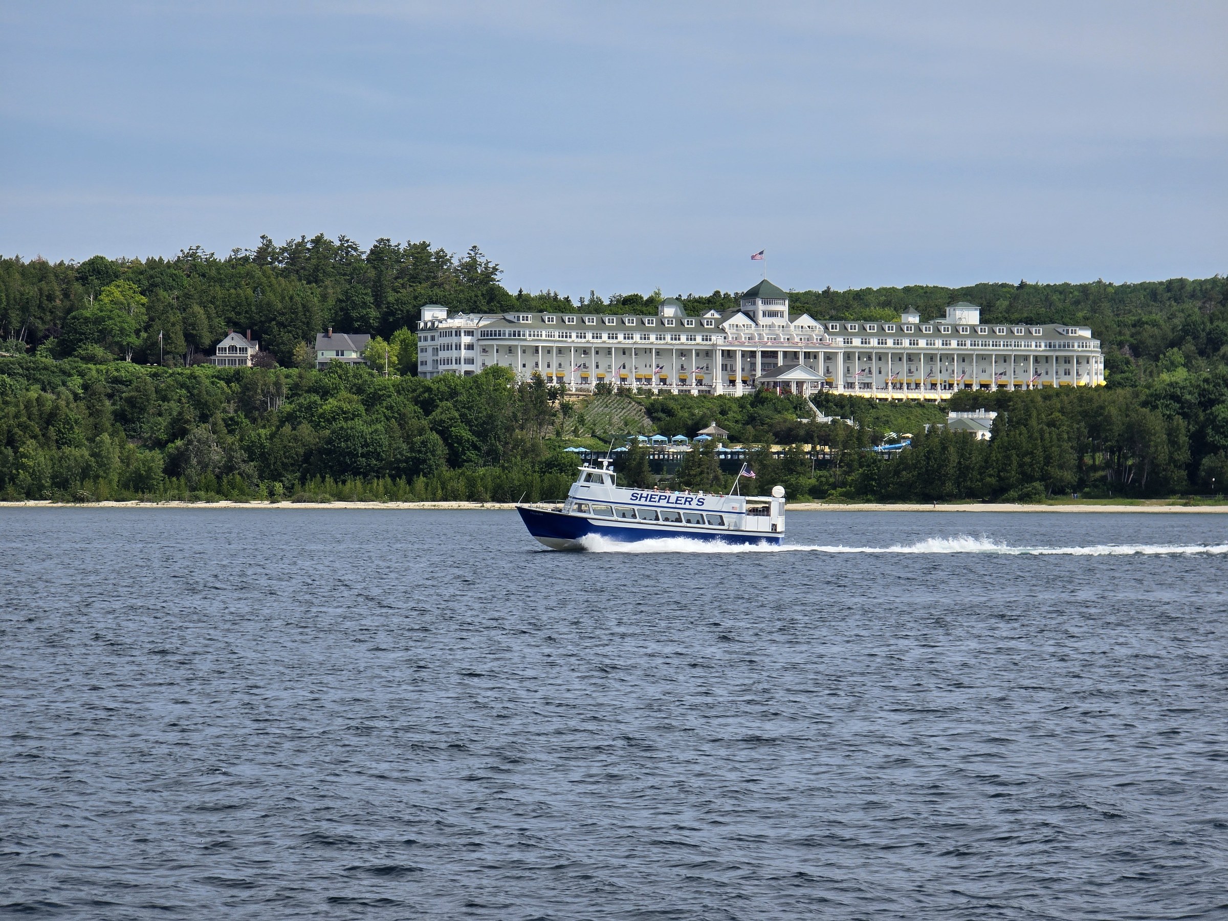 The Grand Hotel from the ferry, another ferry racing past