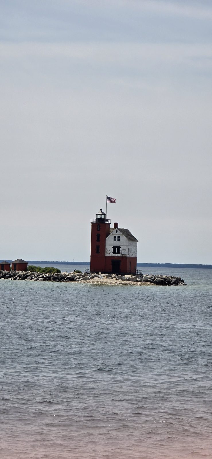 Round Island Lighthouse guarding the harbor entrance