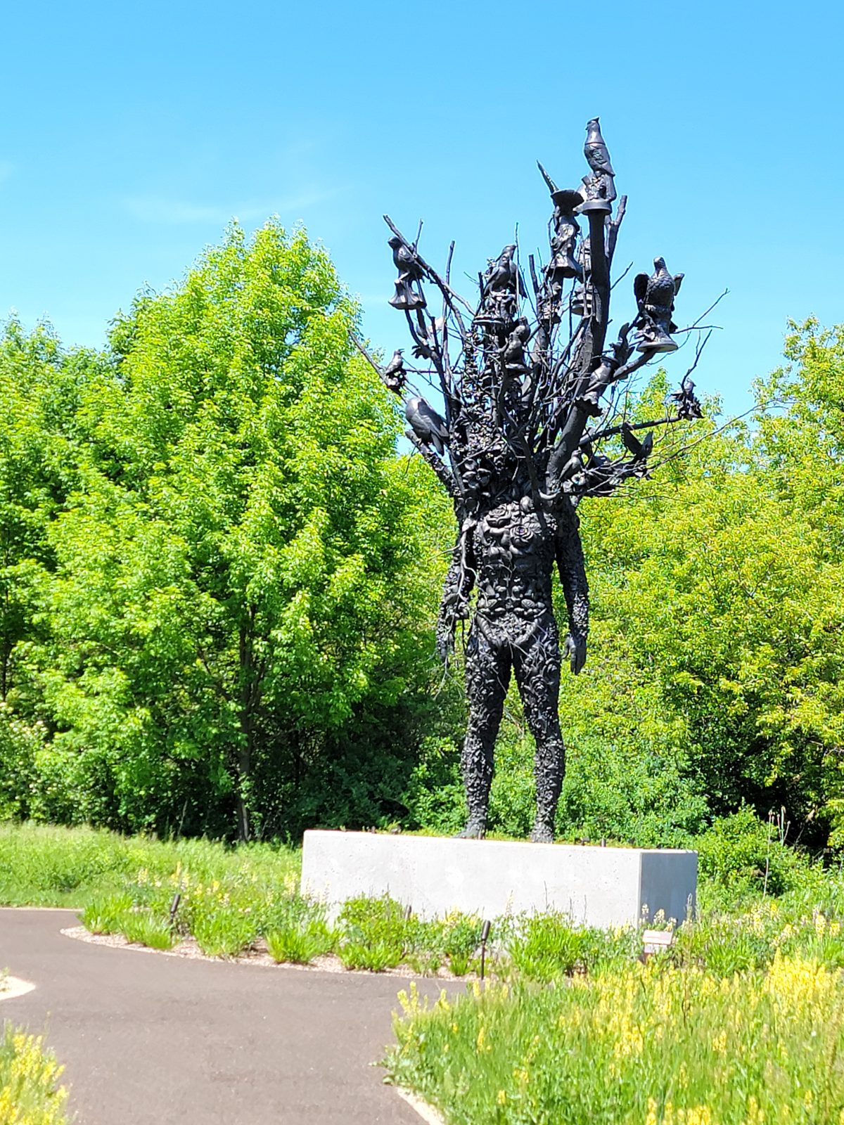 A bronze figure in the sculpture park