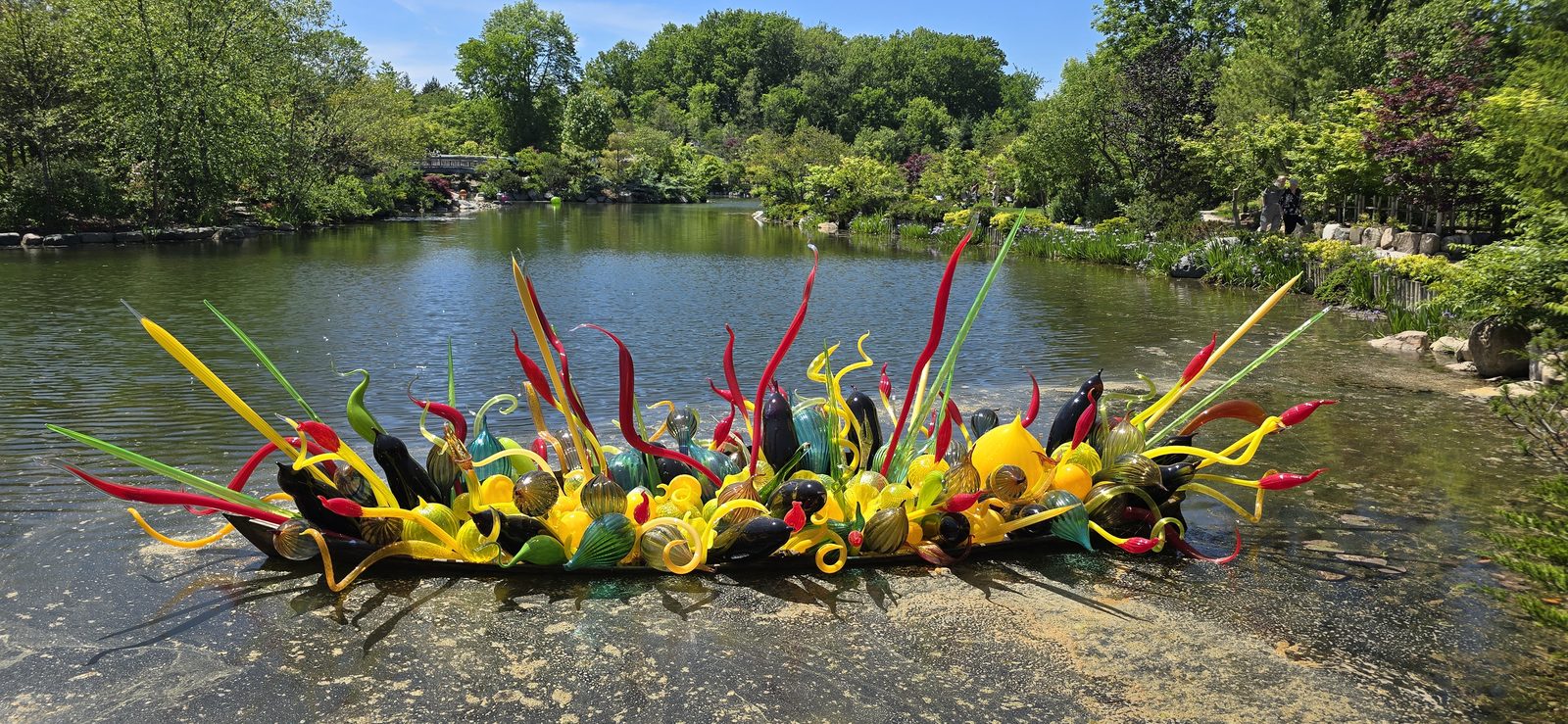 A boat of glass reeds floating on the pond