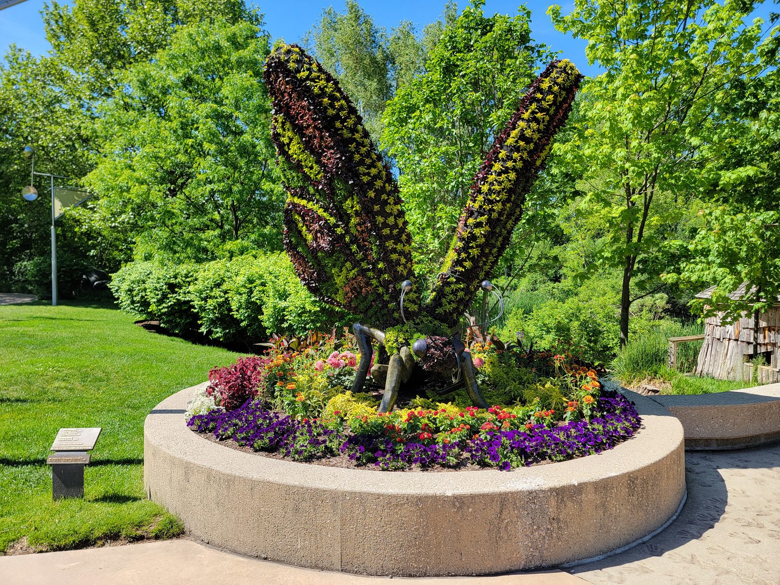 A butterfly made of flowers and metal