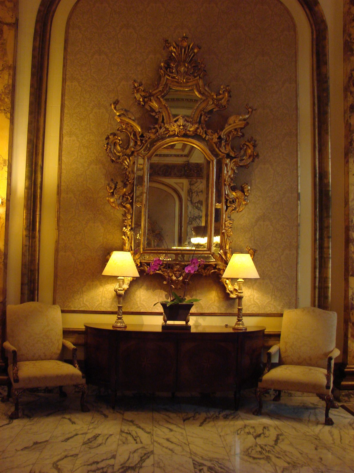 An ornate mirrored sitting room off the lobby