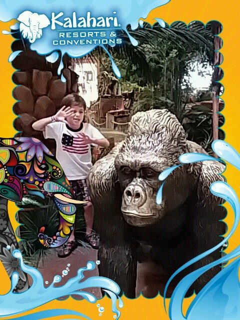 Thomas waves beside the Kalahari gorilla backdrop