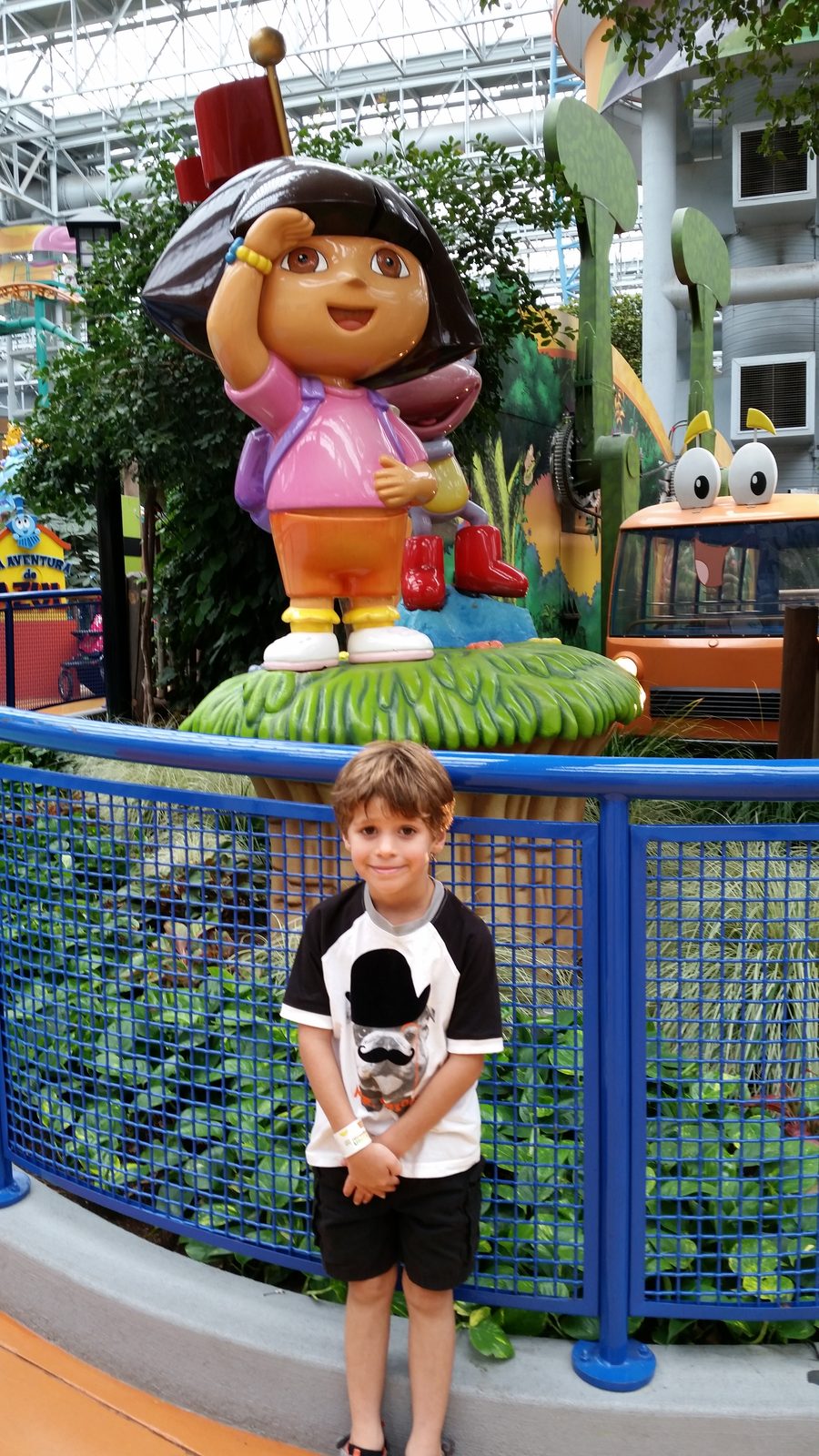 Thomas with the Dora statue at Nickelodeon Universe