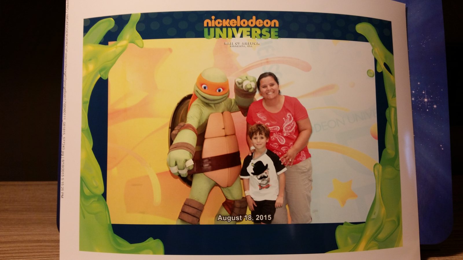 The framed photo of Thomas meeting Michelangelo