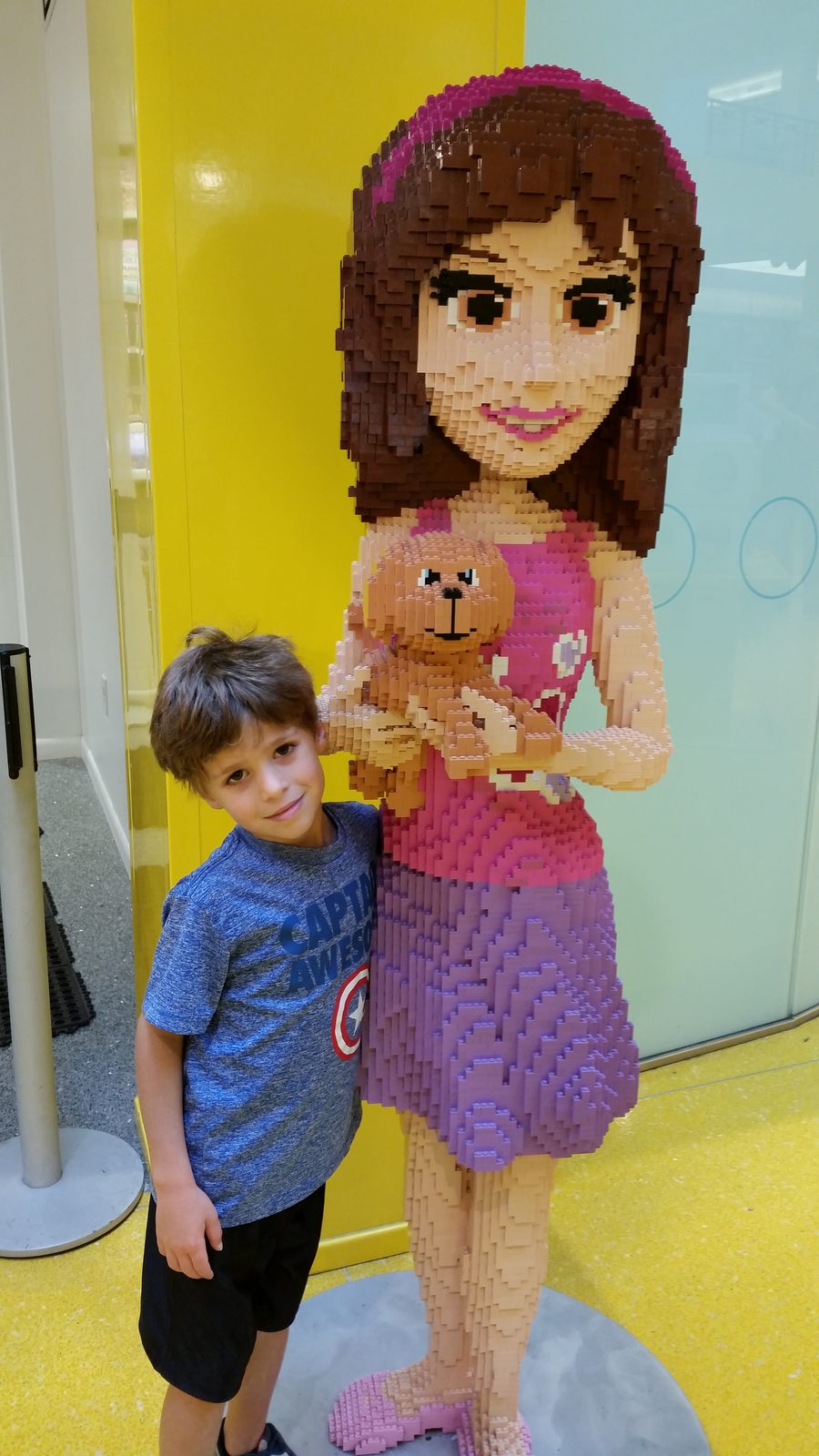 Thomas beside a life-size Lego girl