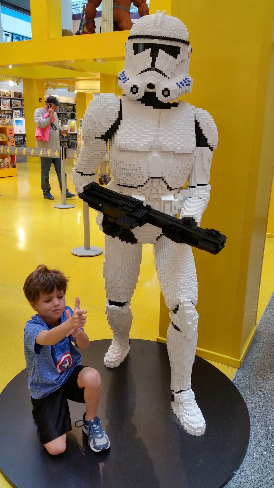 Thomas beside a life-size Lego stormtrooper