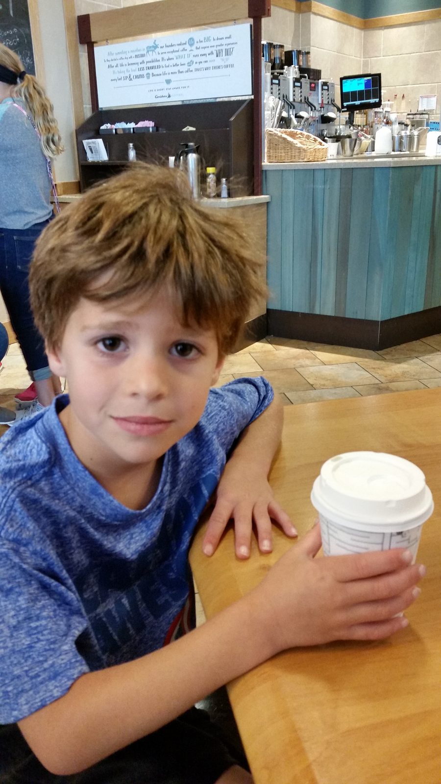 Thomas takes a coffee break before leaving the mall