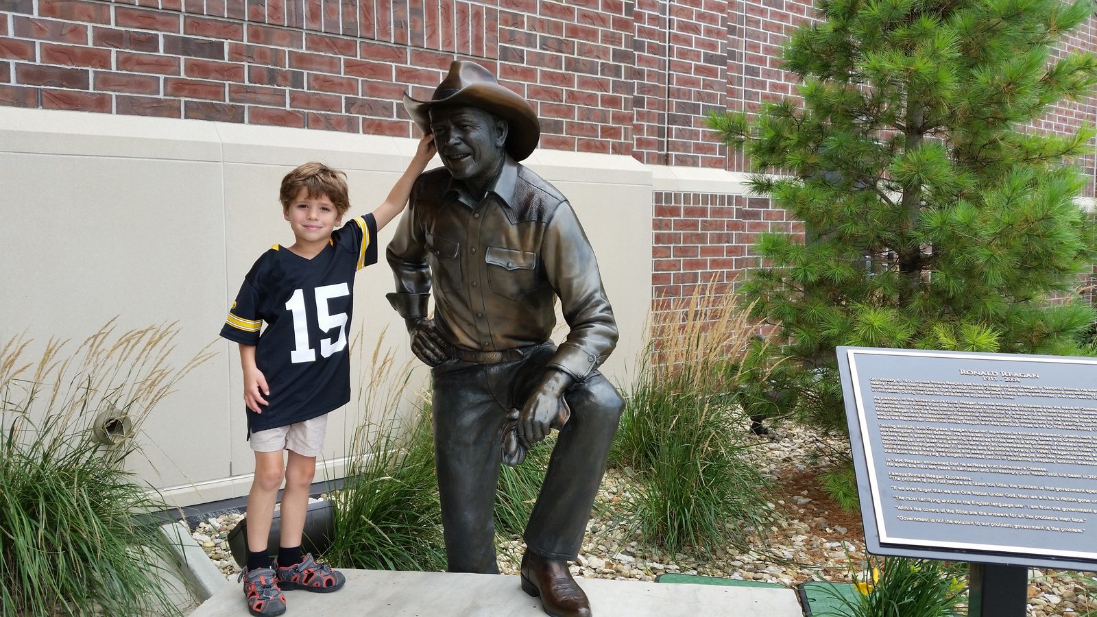 Thomas beside the presidential bench statue