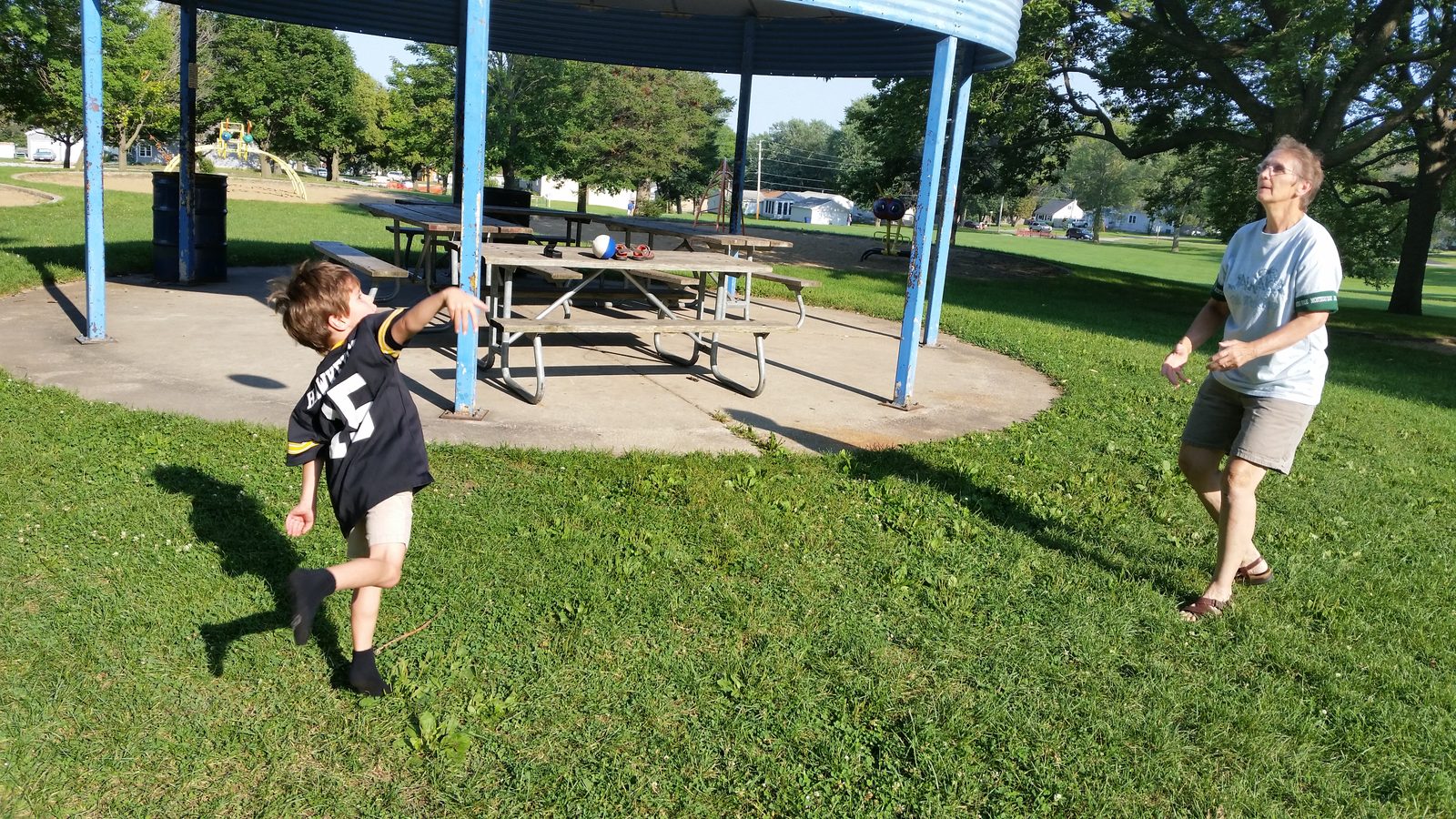 Grandma and Thomas play catch at the park