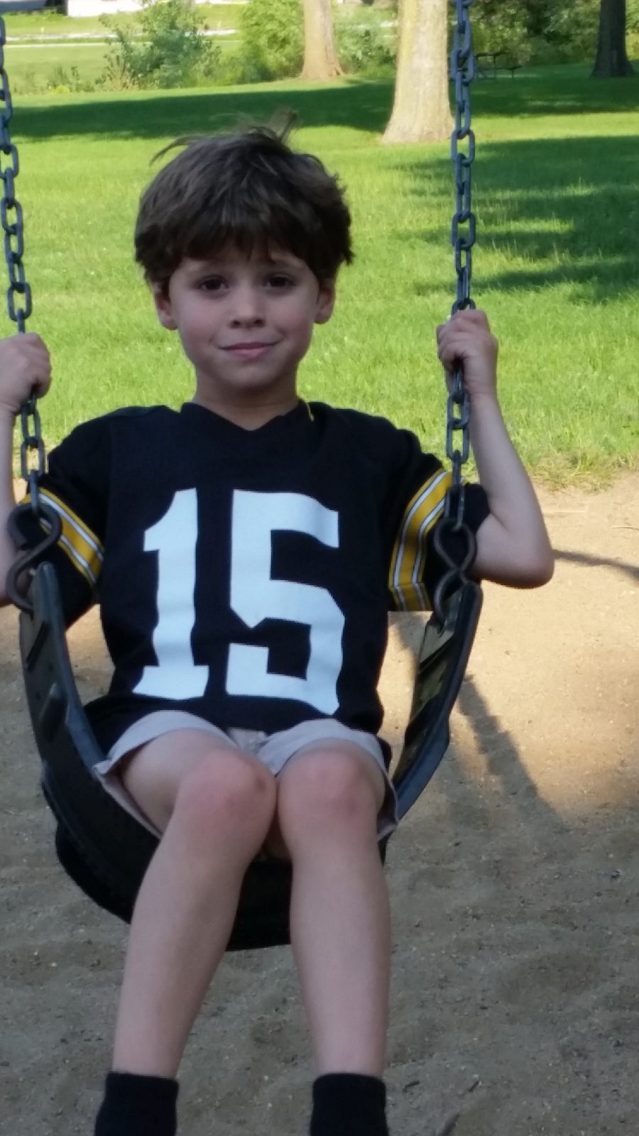 Thomas on the playground swing