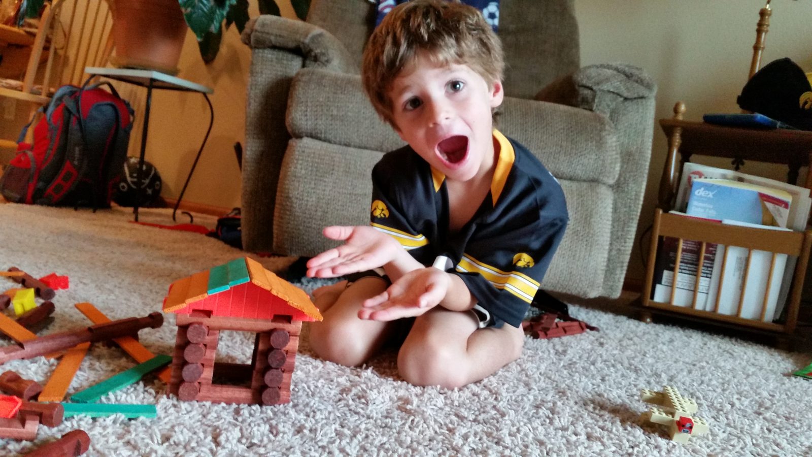 Thomas and his log cabin building