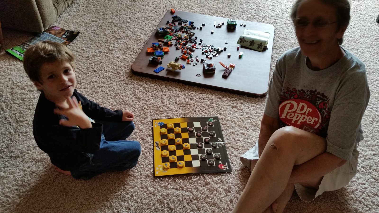 Grandma plays checkers with Thomas