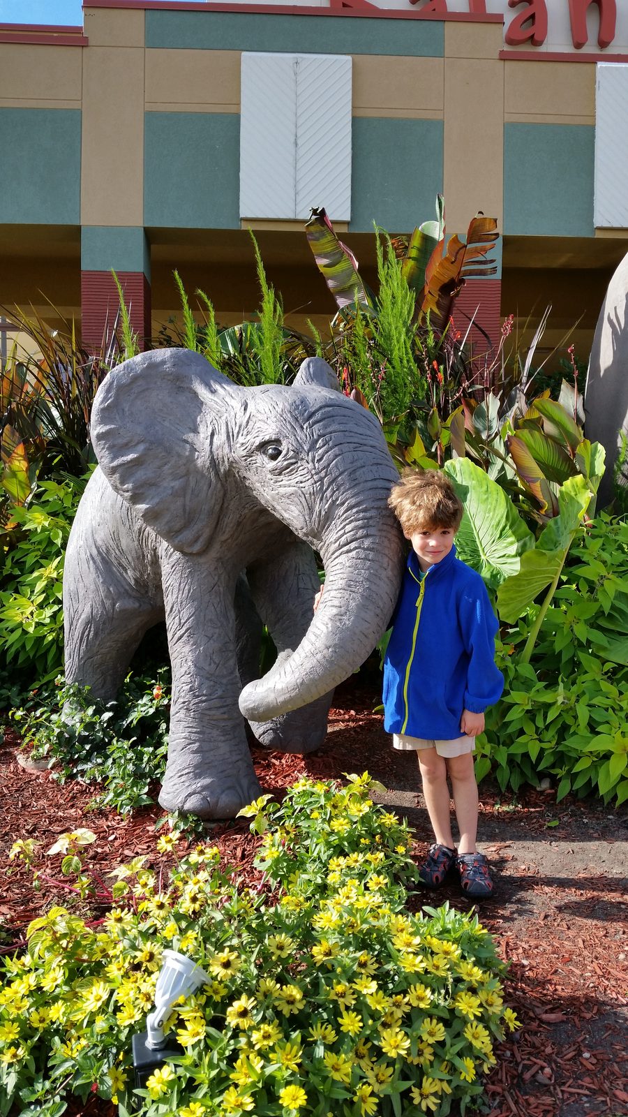 Thomas with the baby elephant statue at Kalahari