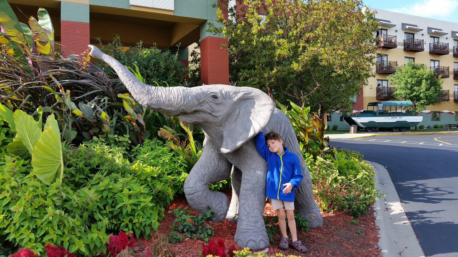 Thomas beside the elephant statue outside