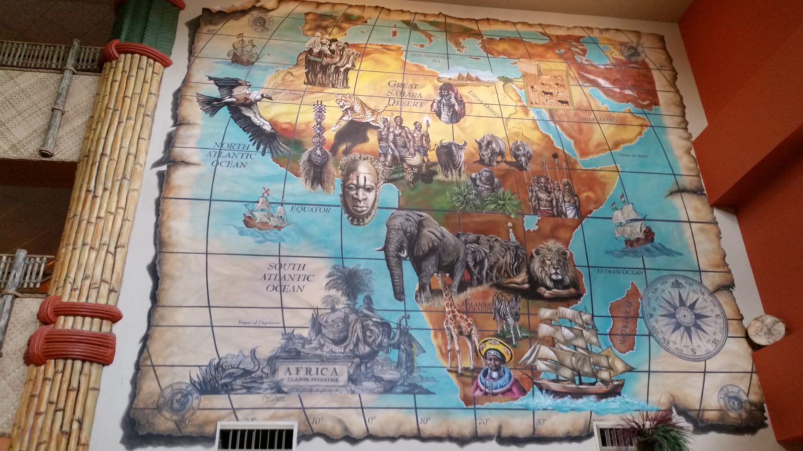 A painted map of Africa on the wall