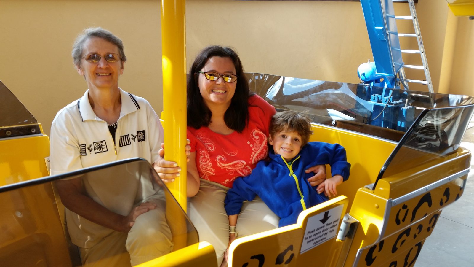 Grandma, Kathy and Thomas share a ride together