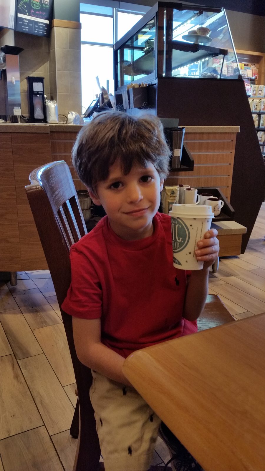 Thomas with a drink at the resort cafe