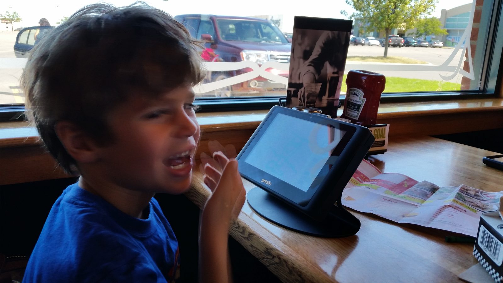 Thomas at a table by the window