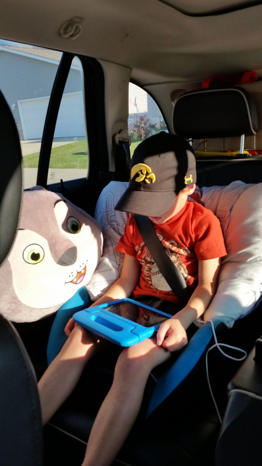 Thomas playing his 3DS on the drive home