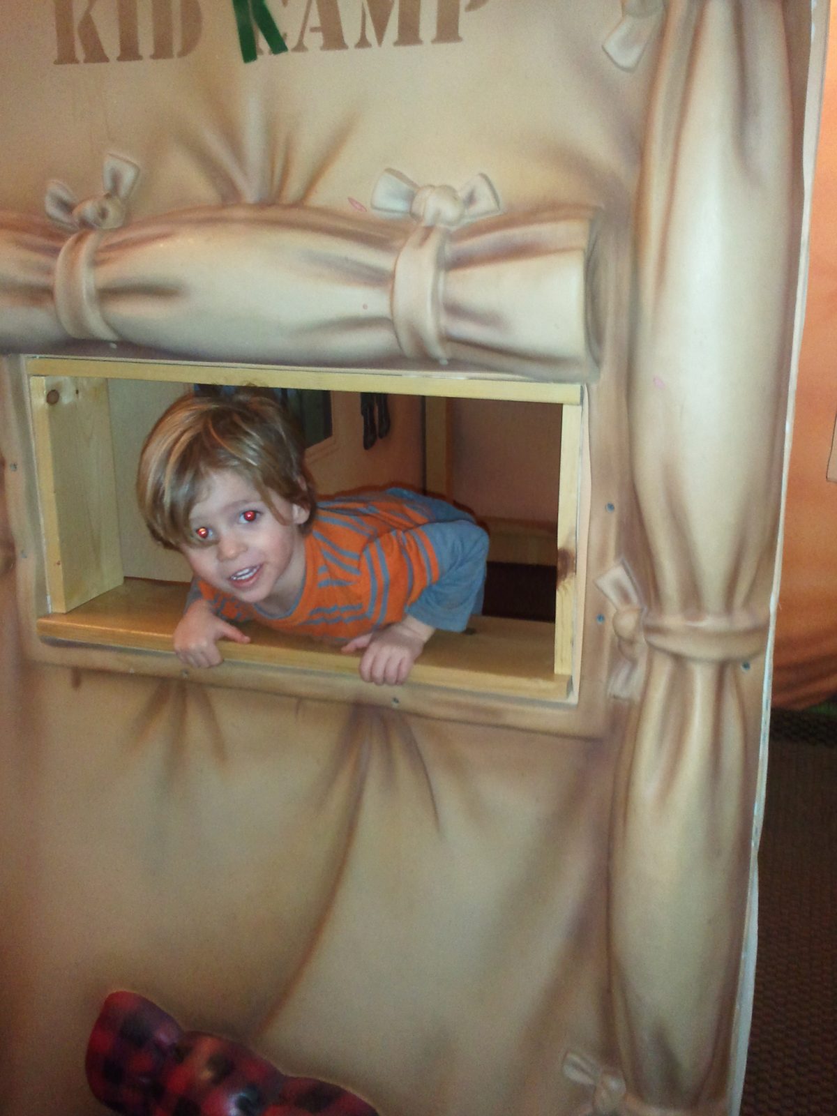Thomas peeking out of the Kid Kamp tent in our room