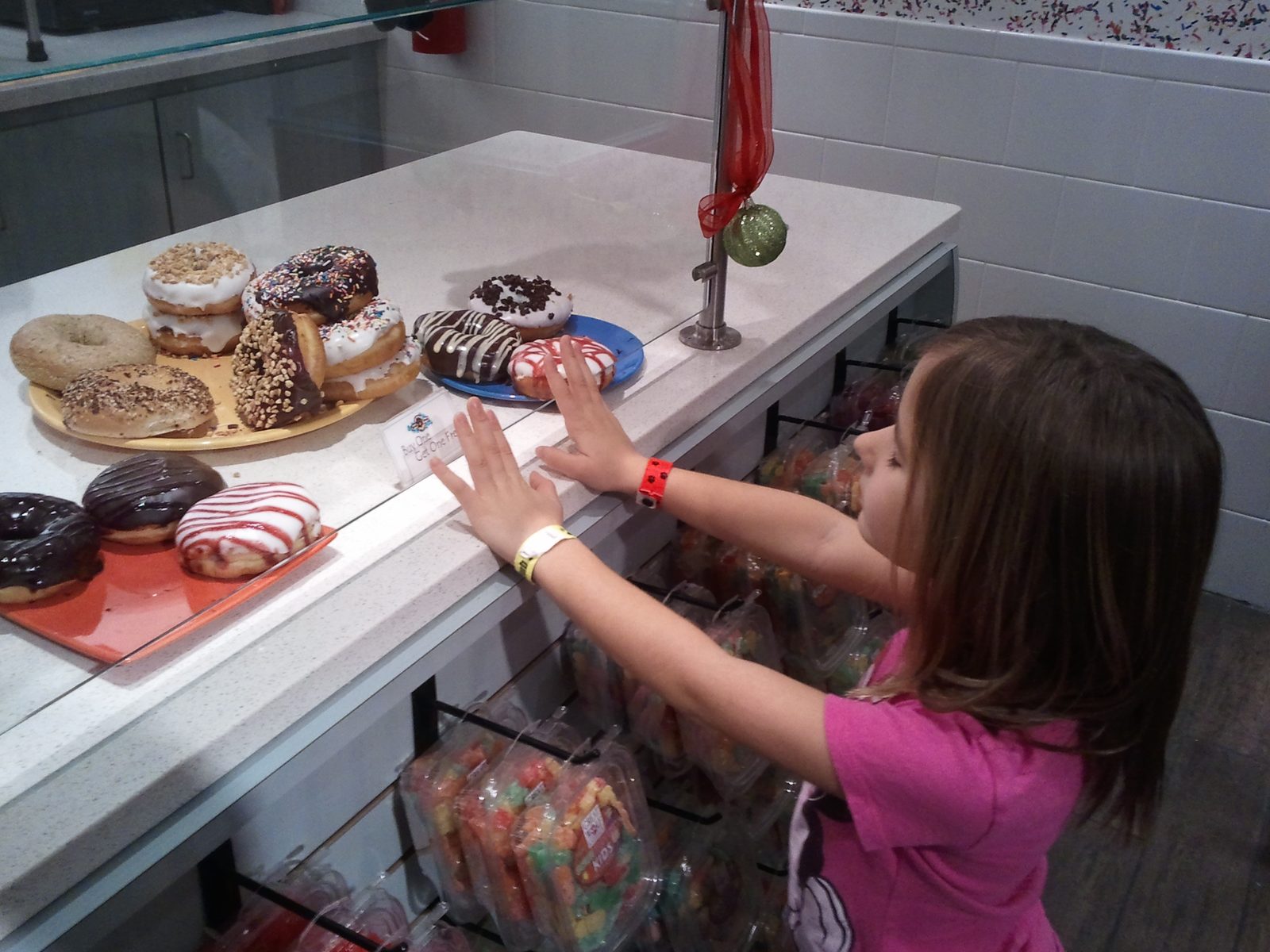 Lisa picks out a donut at the candy counter