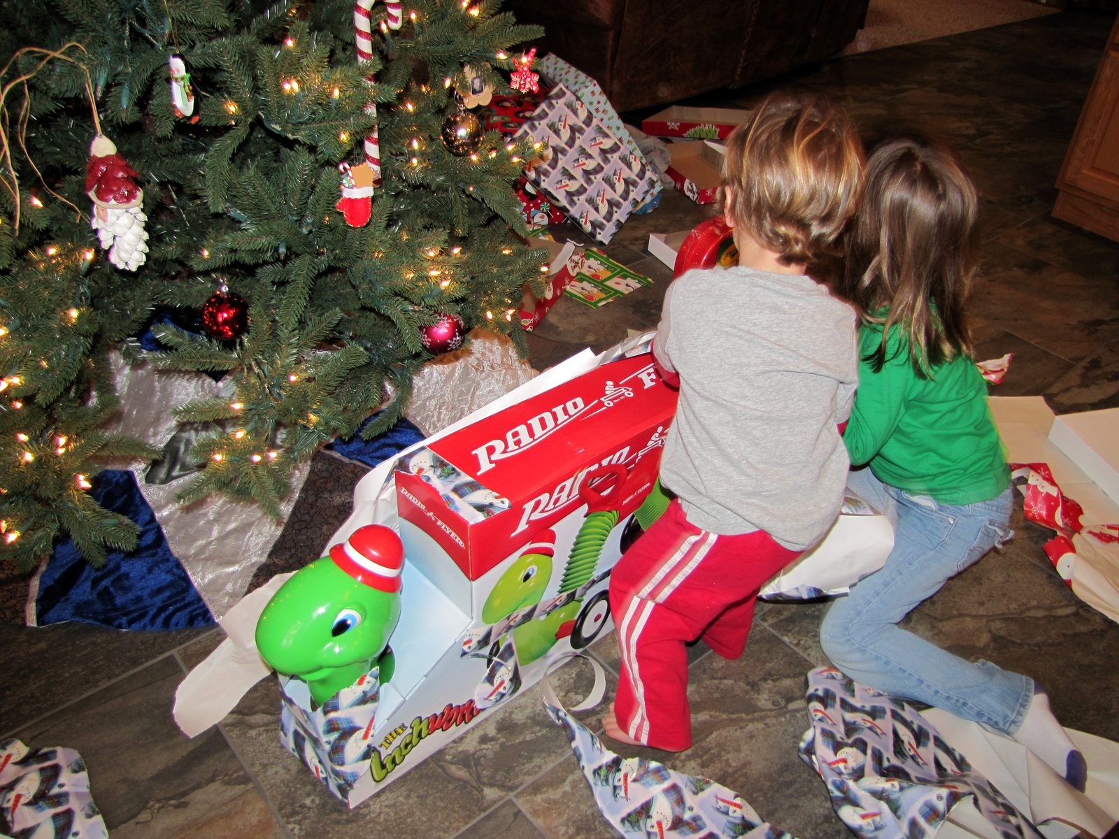 Lisa and Thomas dig into a gift together